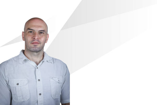 Dr. Alex Dececchi headshot on the left with gray shading behind him. 